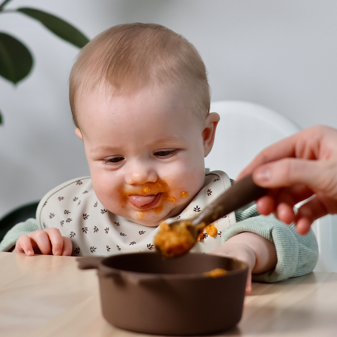 Banner baby being fed