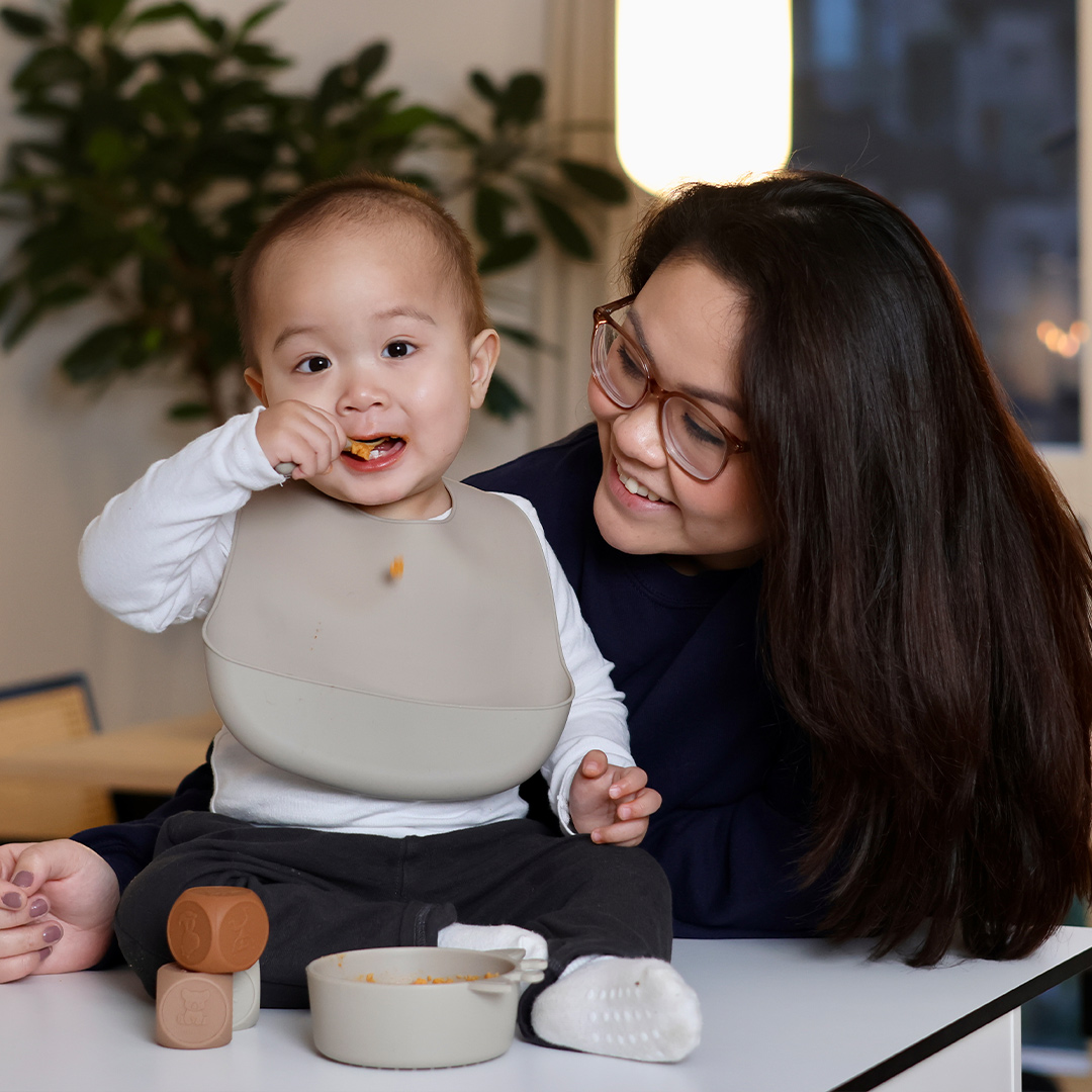 Baby eating with a spoon