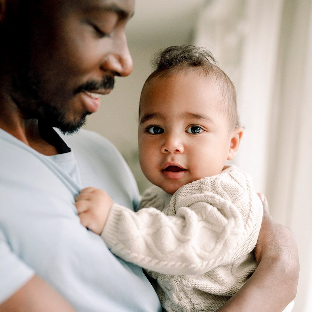 Banner father holding baby