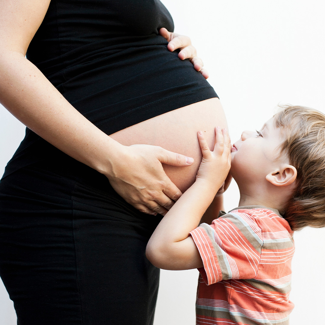 Pregnant woman with child