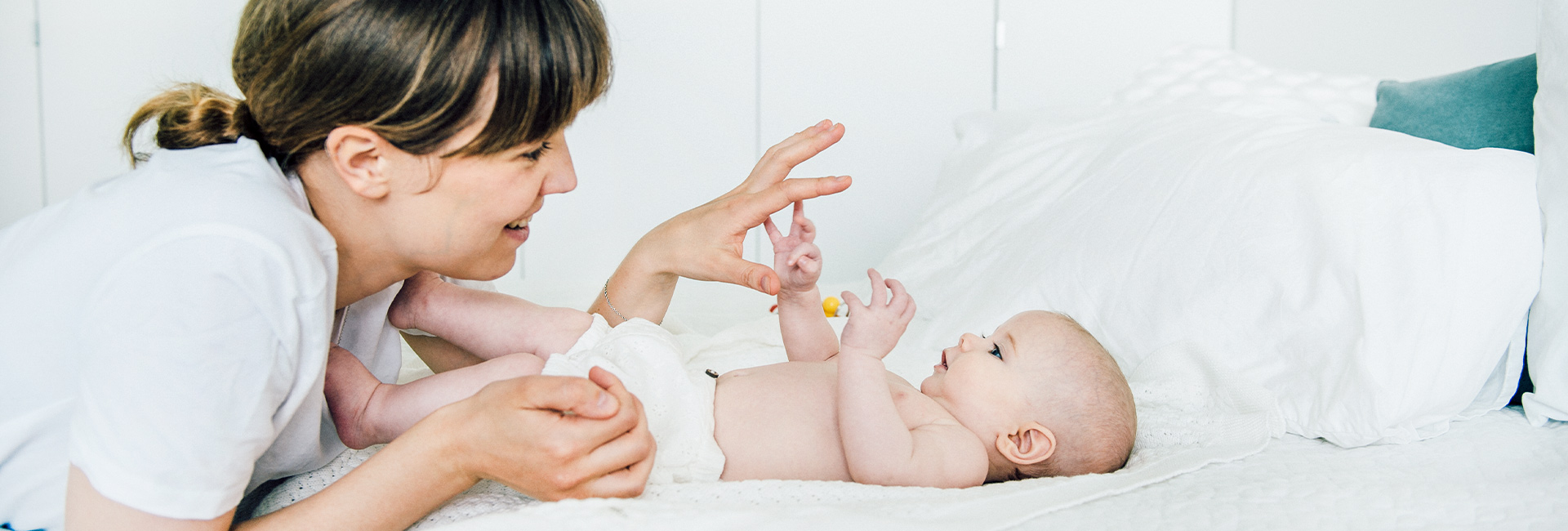 Mother playing with baby